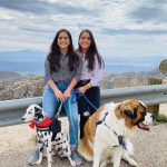 Dr. Briana Hernandez ’16 and Dr. Sophia Hernandez ’16 with their two dogs